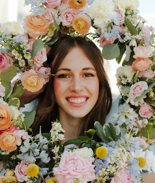 Brinley framed by a beautiful floral wreath
